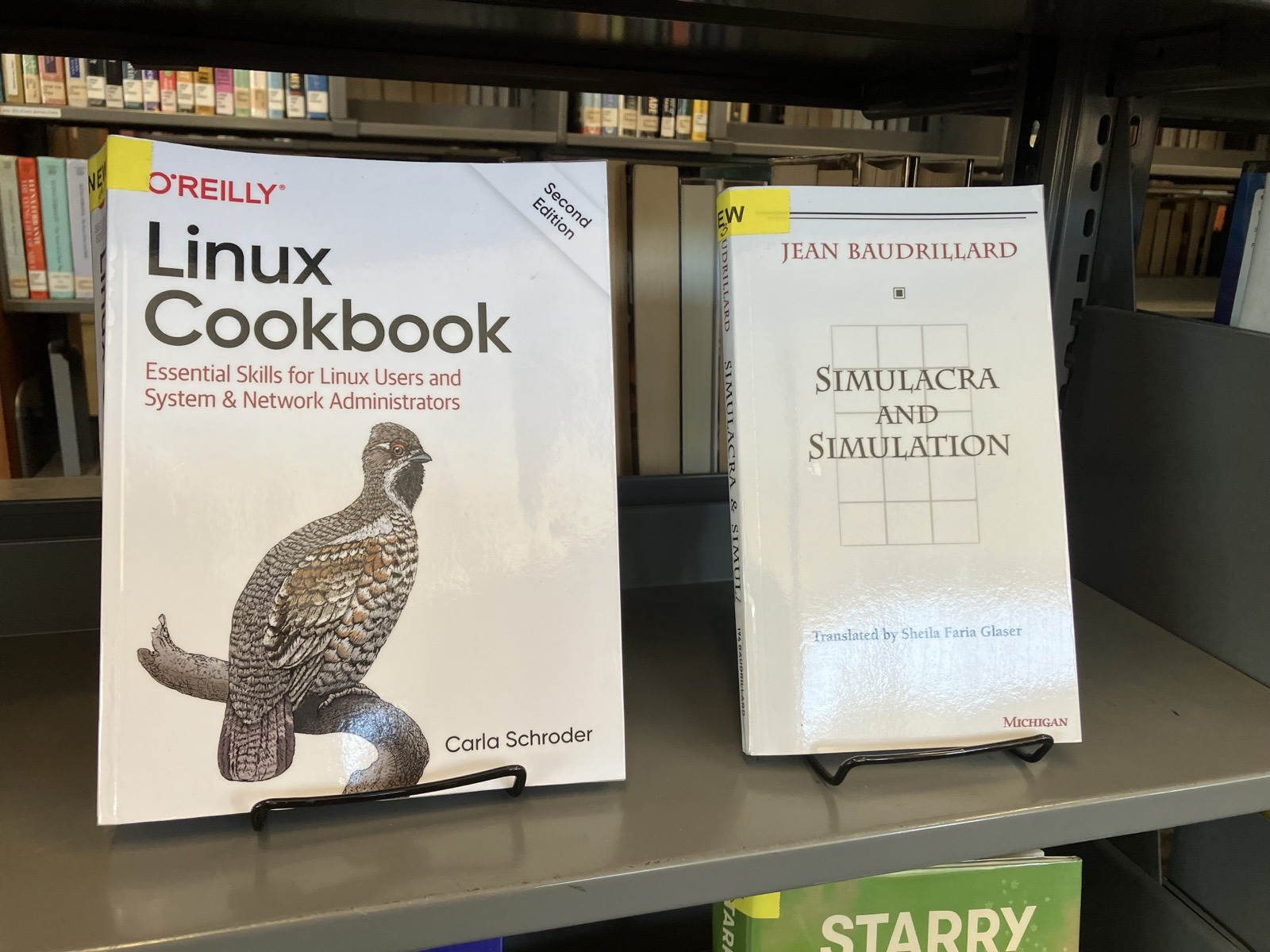 Photo of library bookshelf featuring “Linux Cookbook 2nd Edition”